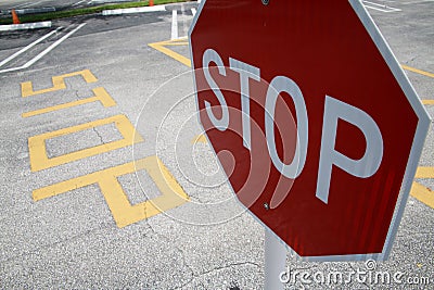 Stop Sign in Parking Lot Stock Photo