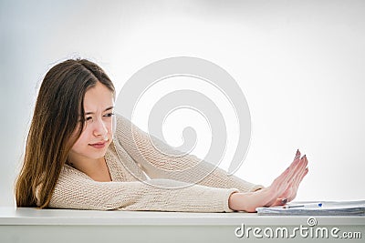 Stop studying: young teenager girl has enough of books Stock Photo