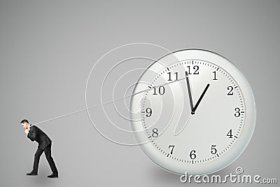 Stop timing concept with businessman trying to stop the time Stock Photo