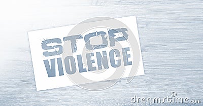 Stop violence words on card on wooden table. Social concept Stock Photo