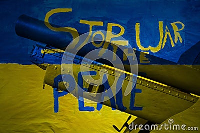 Stop the war peace painting on wall ukraine flag with cannon Stock Photo