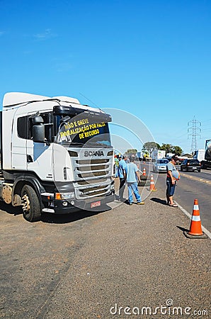 Stopped trucks on the highways for protest the diesel price increase in Brazil. Editorial Stock Photo