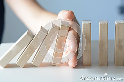 Stopping the domino effect concept with a business solution Stock Photo