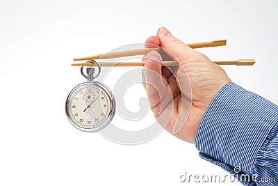 Stopwatch on bamboo chopsticks. speed concept for cooking and eating food Stock Photo