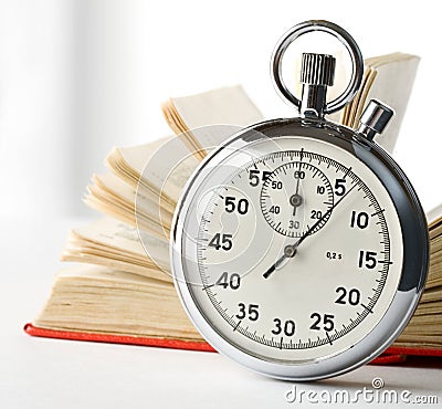 Stopwatch and book Stock Photo