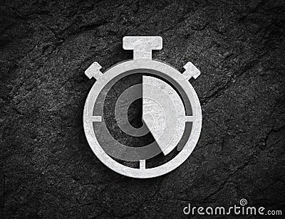 Stopwatch symbol stone wall background Stock Photo