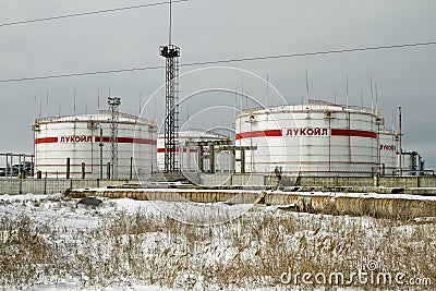 Storage of light petroleum products on the territory of the refinery, with the inscription LUKOIL. Editorial Stock Photo