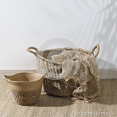 Storage room. Wooden stairs, wicker baskets on mat. Copy space. Place for text. Copy space Stock Photo