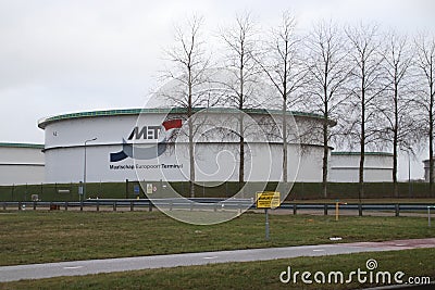 Storage tanks of the Maatschap Europoort Terminal at the Europort harbor Editorial Stock Photo