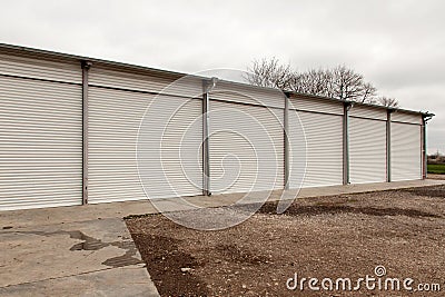 Storage units with roller shutter doors in industrial area Stock Photo