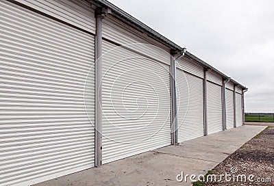 Storage units with roller shutter doors in industrial area Stock Photo