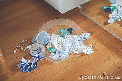 Storage in wardrobe. Preparing for the birth of a child. Stock Photo