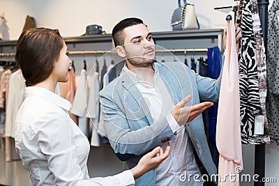 Store clerk serving purchaser Stock Photo