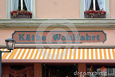 Store front with logo of German company Kathe Wohlfahrt that sells Christmas decorations and articles through the whole year Editorial Stock Photo