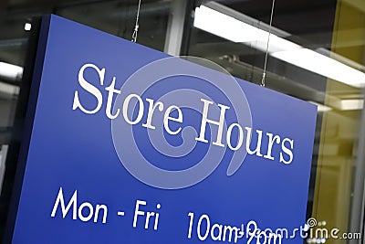 Store hours sign Stock Photo