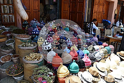 Store at the Jemaa el Fnaa market with colorful knitted hats Editorial Stock Photo