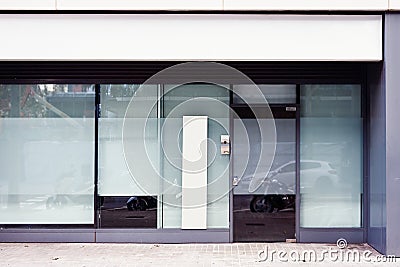 Store office entrance with empty advertising banner outdoor above door and window, space for design layout Stock Photo