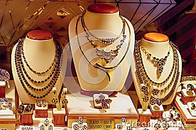 Store Window Display of Gold and Garnet Jewelry Stock Photo