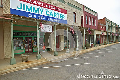 Storefront with banner exclaiming Plains Georgia to be the home of Jimmy Carter, our 39th President in Plains, Georgia Editorial Stock Photo
