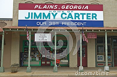 Storefront with banner exclaiming Plains Georgia to be the home of Jimmy Carter, our 39th President in Plains, Georgia Editorial Stock Photo