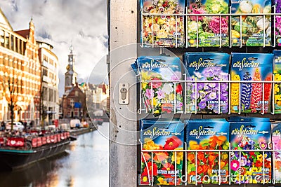 Storefront with seeds of plants in the Bloemenmarkt flower market on the background of the city channel of Amsterdam Editorial Stock Photo