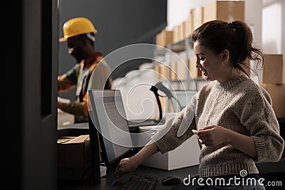 Storehouse manager analyzing merchandise checklist Stock Photo