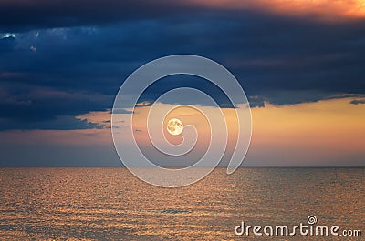 Storm cloud over the sea. sunset. moon rise Stock Photo