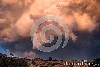 Storm Clouds Illuminated by Sunset Stock Photo