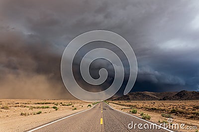 Storm clouds over a long empty road Stock Photo