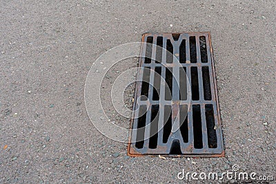 Storm drain manhole, metal cover for outdoor drainage Stock Photo