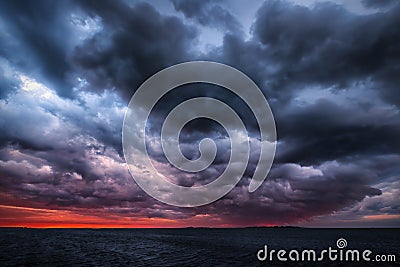 Storm on an ocean sunset Stock Photo