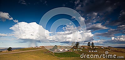 Storm over rural village Stock Photo