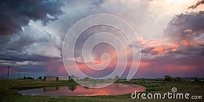 Storm over rural village Stock Photo