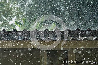 Storm rain on the roof of the house Stock Photo