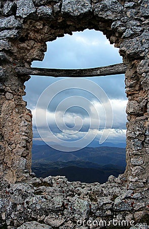 The storm in the valley, seen through the gash in the ruined wall, Rocca Calascio, L`Aquila, Abruzzo, Italy Stock Photo