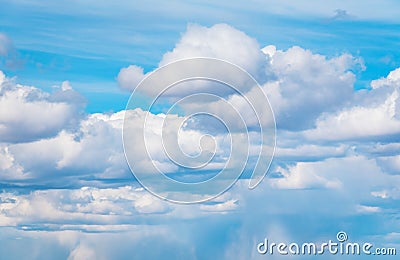 Stormy blue sky background with fluffy huge clouds. Sunny blue sky background with clouds. Stock Photo