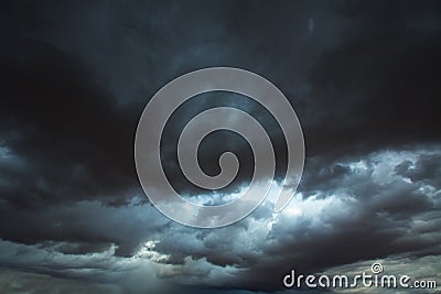 Stormy clouds gray sky with dramatic shadows Stock Photo