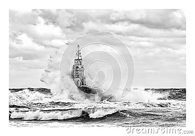 Stormy cloudy day. Dramatic sky and huge waves at the Lighthouse, Ahtopol, Bulgaria Stock Photo