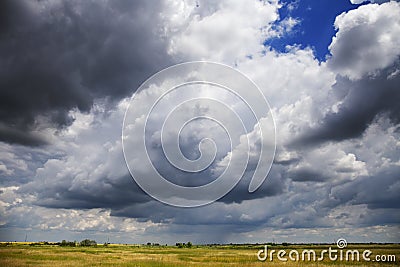 Stormy cloudy sky over the plain Stock Photo