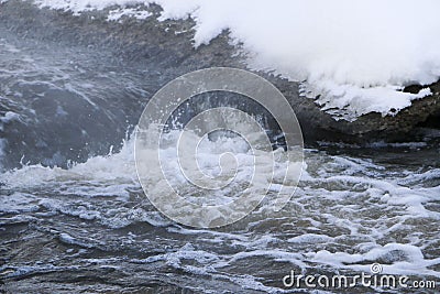 Stormy creek. wave and foam in the flow. splashes, bubbles, waves, stream, ripples and crests of waves in a fast forest stream in Stock Photo