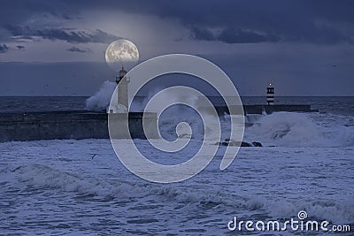 Stormy full moon night at river mouth Stock Photo