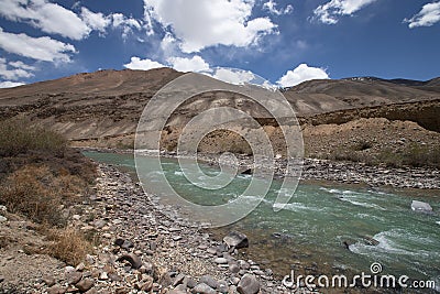 Stormy mountain river in valley in the foothills of the Fann mountains. Landscape. Stock Photo