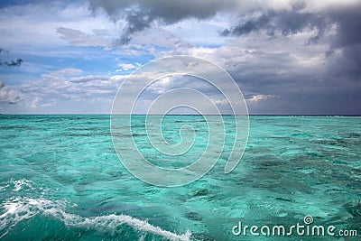 Stormy tropical sky over turquoise water, Caribbean sea off Grand Cayman Stock Photo