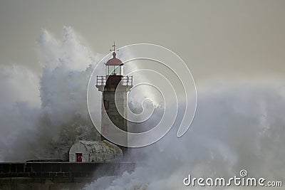 Stormy wave over lighthouse Stock Photo