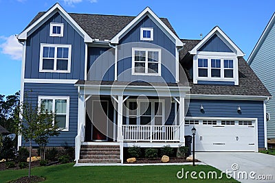 Two-story, blue, suburban home in a neighborhood in North Carolina Stock Photo