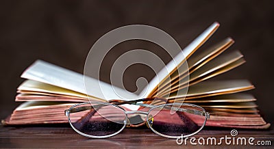 Story book, storytelling concept, old book and eyeglasses Stock Photo