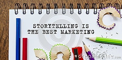 Storytelling is the best Marketing text written on a paper with pencils in office Stock Photo