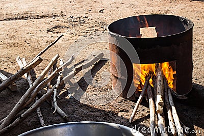 Stove firewood made of gallon tank for cooking. Stock Photo