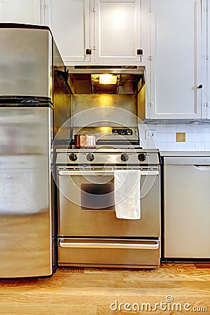 Stove and refrigerator steal with white kitchen. Stock Photo