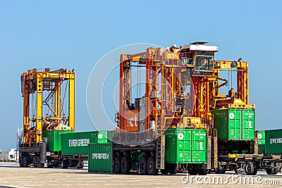 Straddle carrier used for moving containers in a container terminal. Editorial Stock Photo